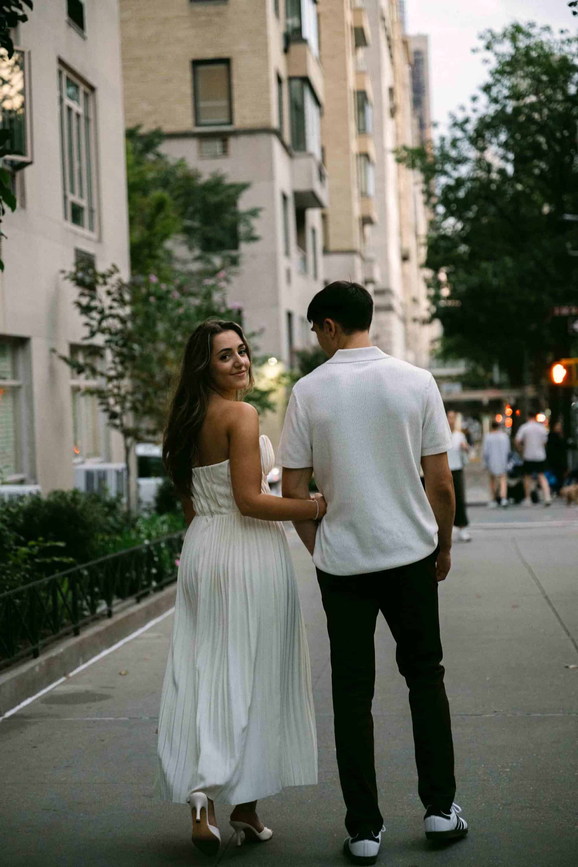 Celena and Cameron embracing during their Central Park engagement photos