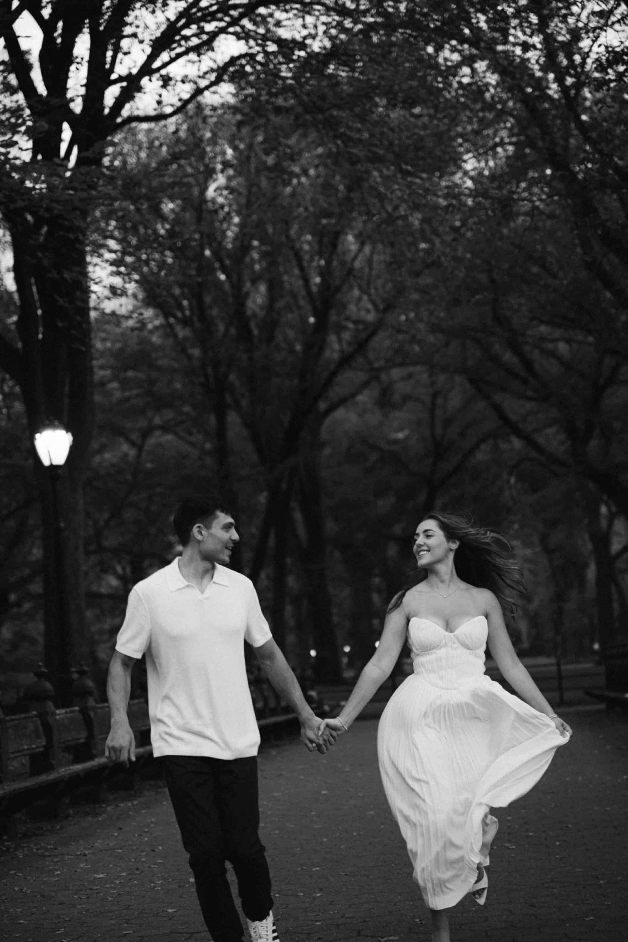 Celena and Cameron embracing during their Central Park engagement photos