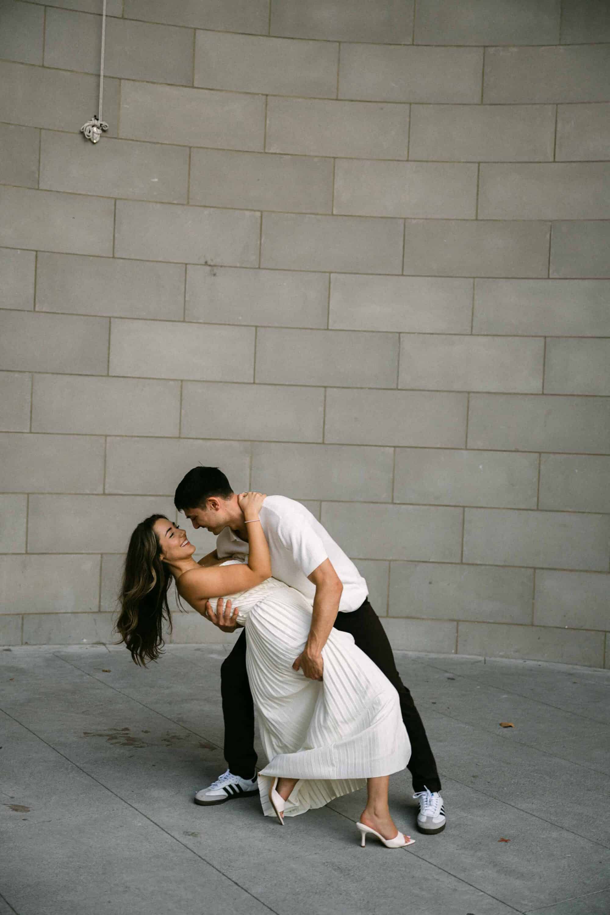 Celena and Cameron embracing during their Central Park engagement photos