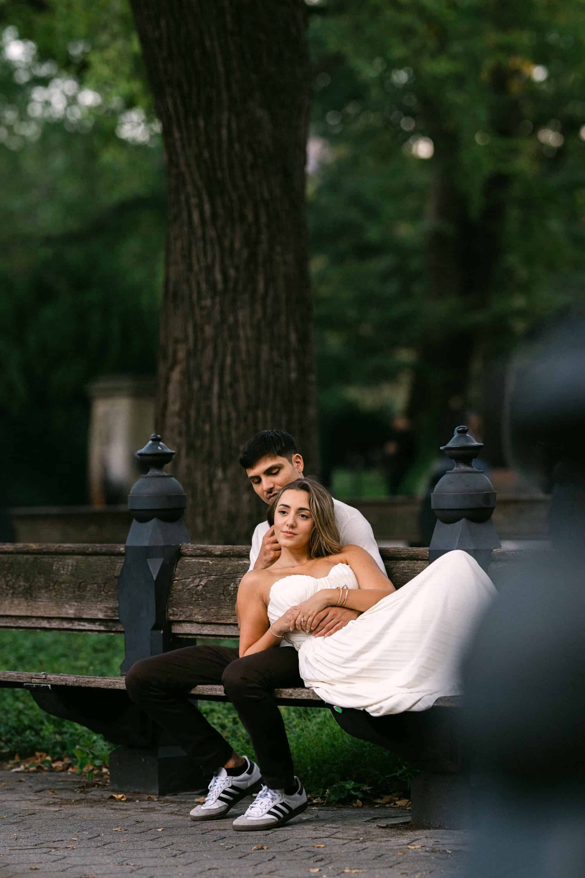 Candid Central Park engagement photos of a couple walking through the park