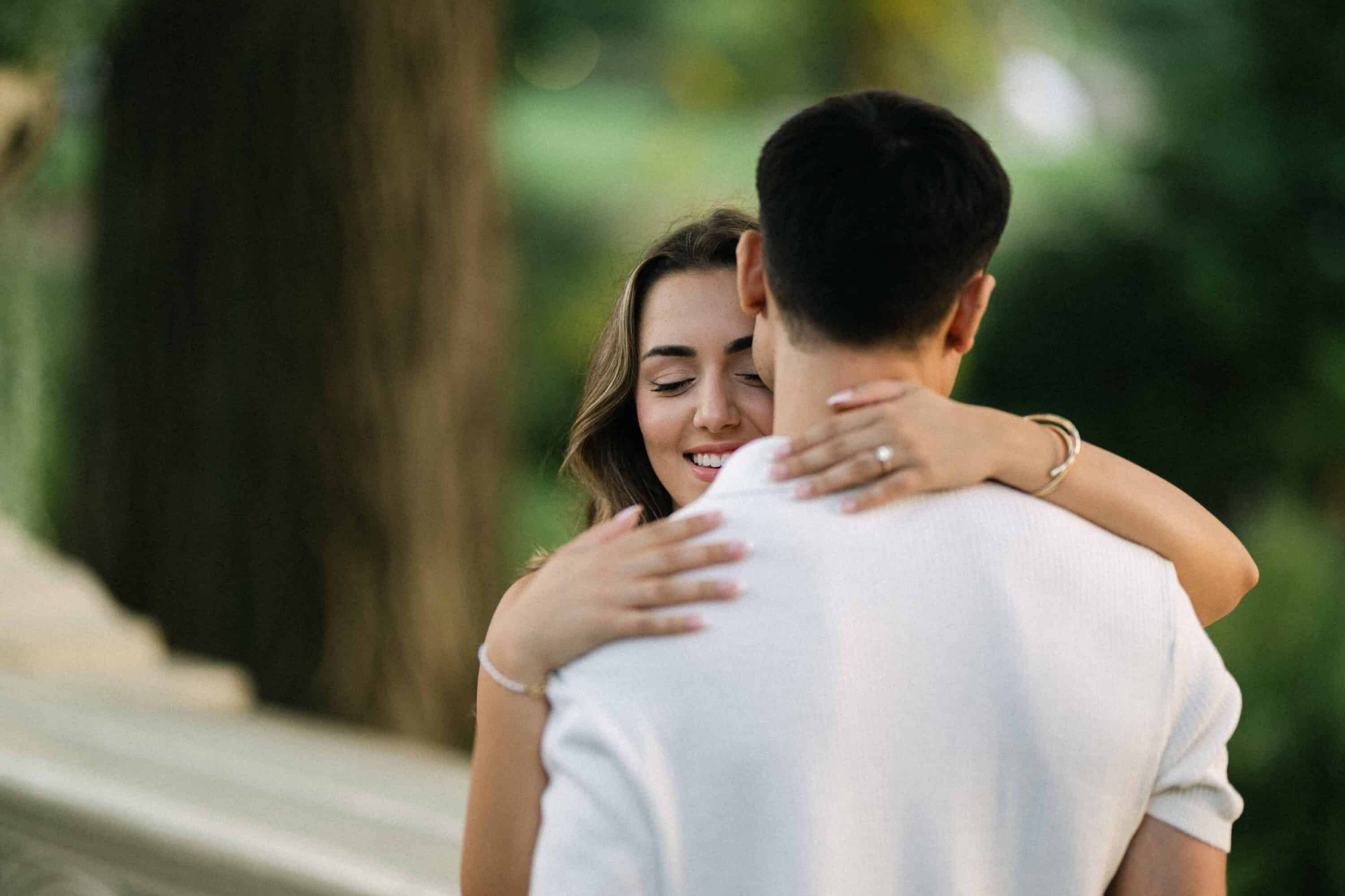Celena and Cameron embracing during their Central Park engagement photos