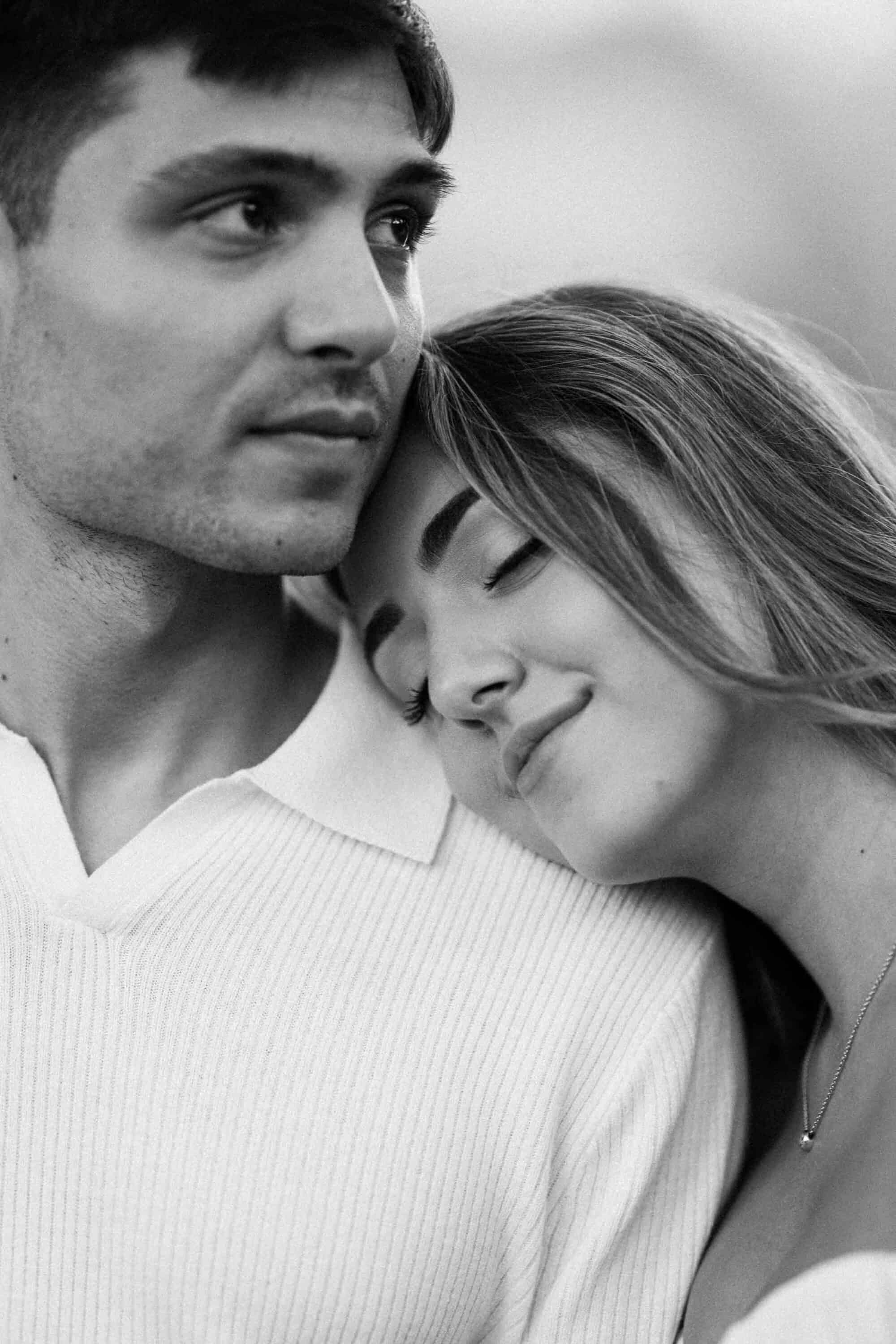 Candid Central Park engagement photos of a couple walking through the park