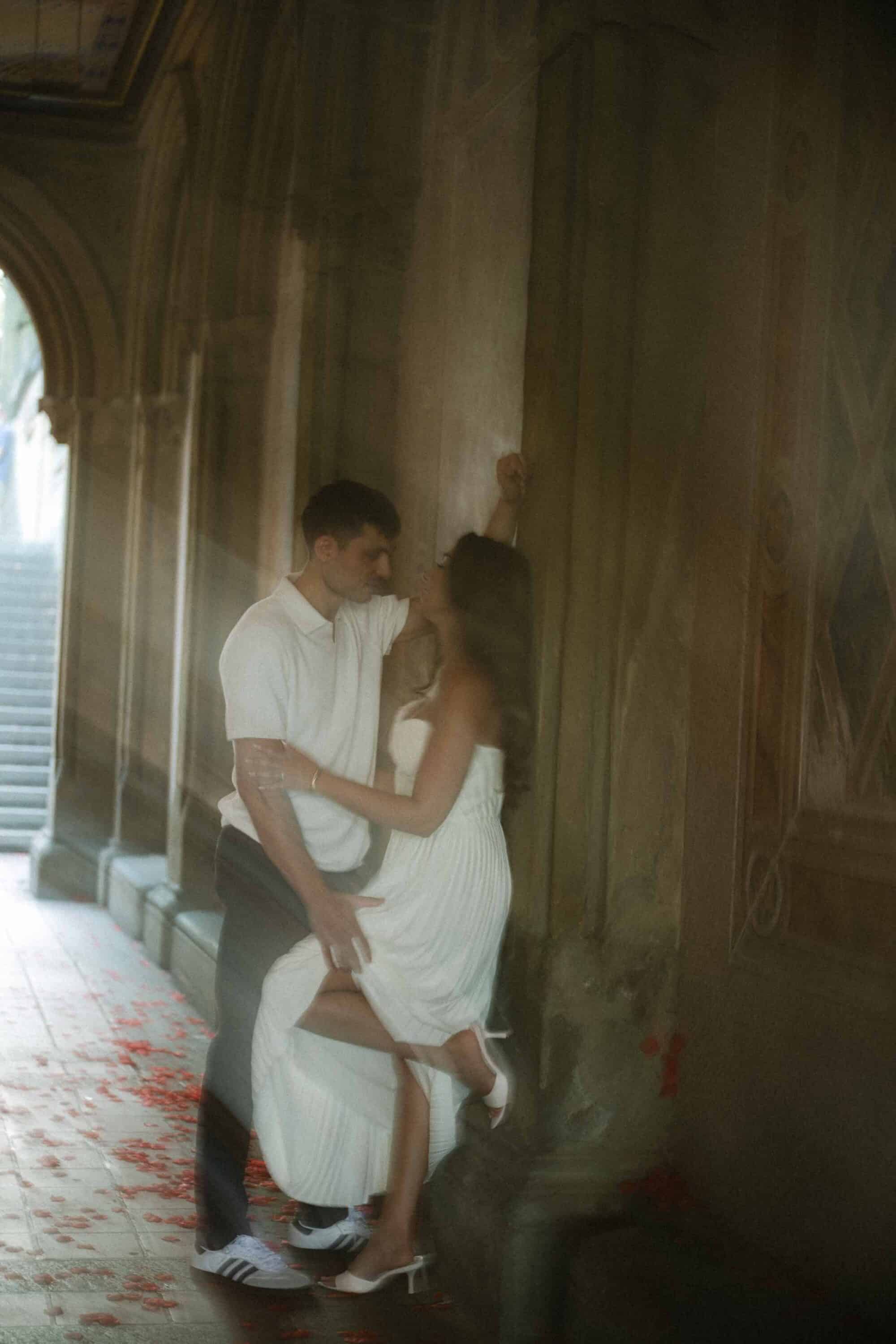 Celena and Cameron embracing during their Central Park engagement photos