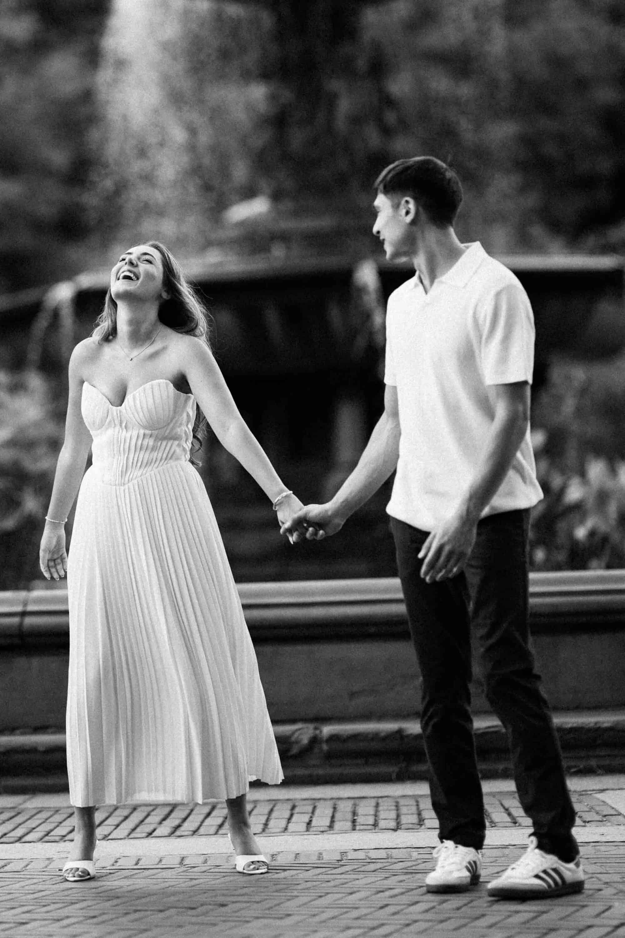 Documentary Central Park engagement session, Celena and Cameron laughing together
