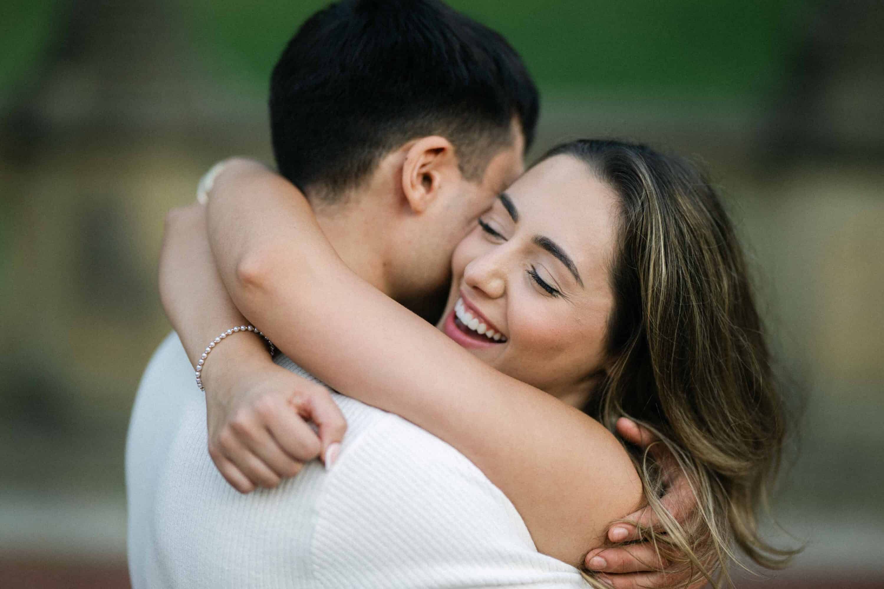 Celena and Cameron embracing during their Central Park engagement photos