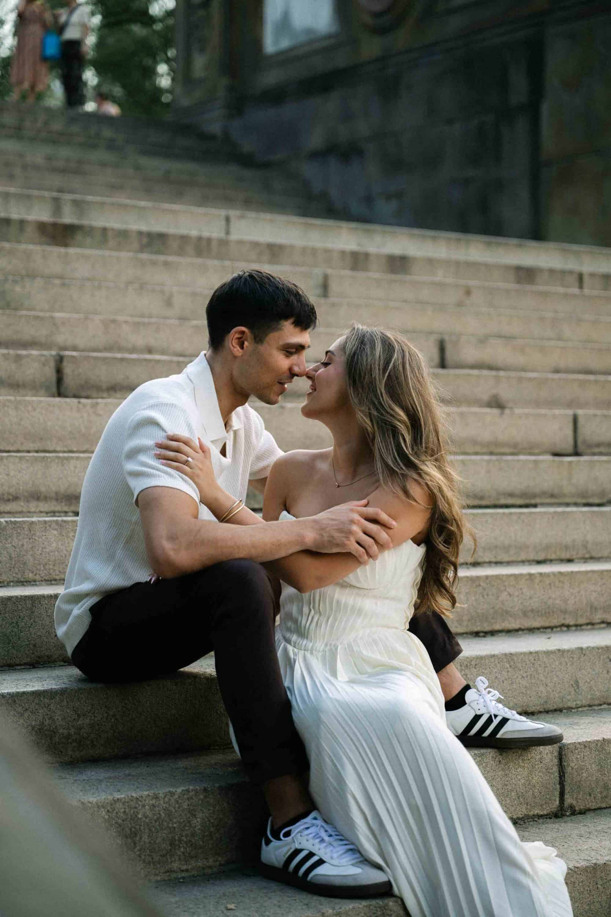 Candid Central Park engagement photos of a couple walking through the park